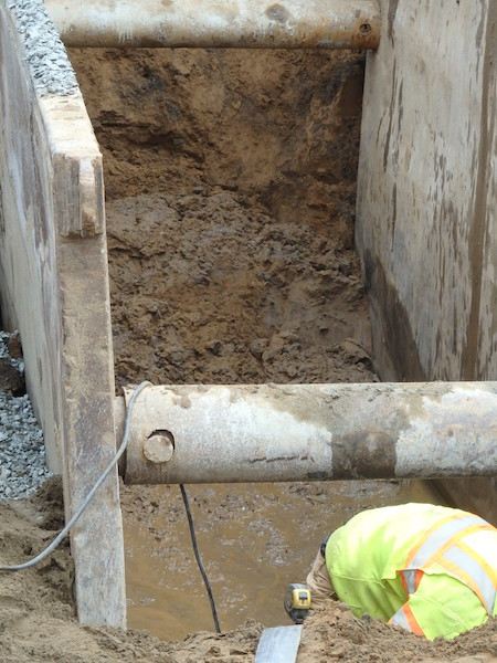 excavation on Elmwood
St to install new water main showing saturated sand of the top
of the water table