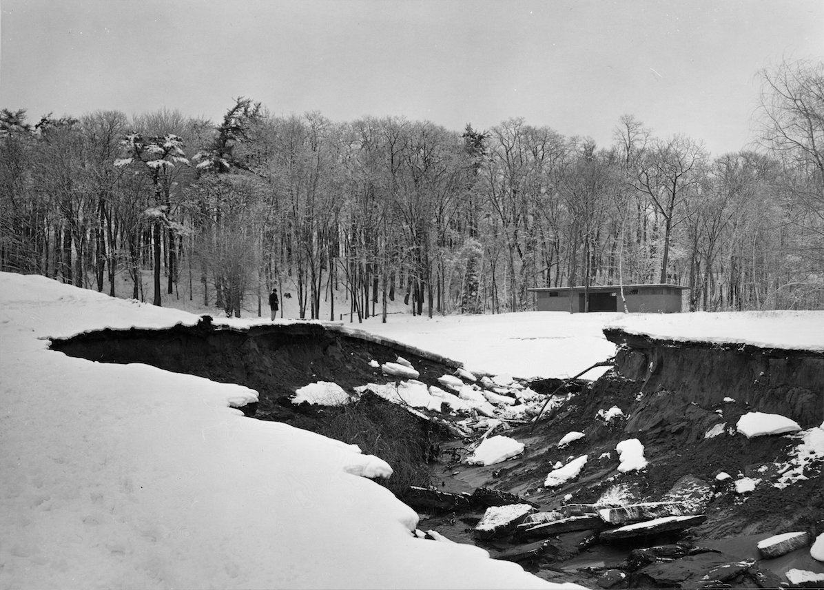 view N
to the pond of the channel eroded through the dam